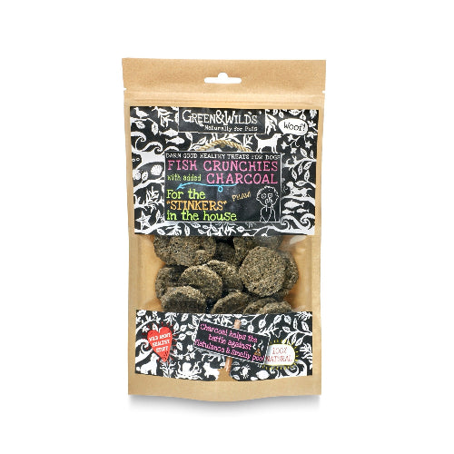 Packaged dog treats with charcoal flavor on a white background